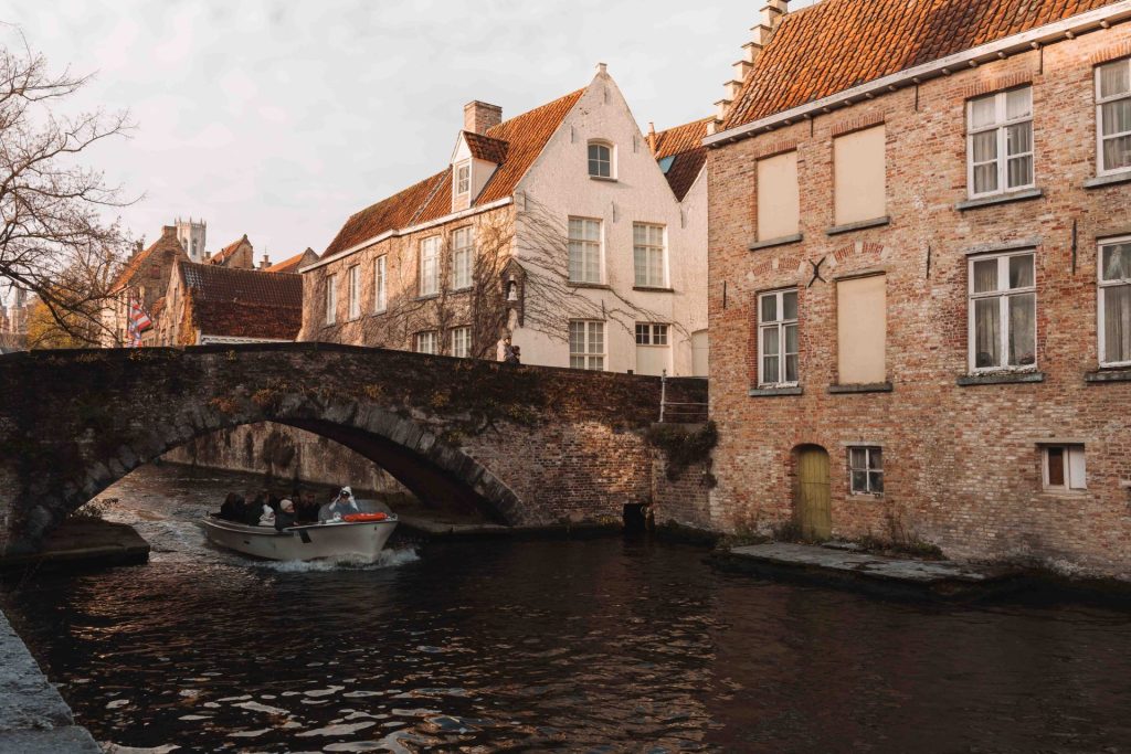 Canal boat tour in Bruges during winter.
