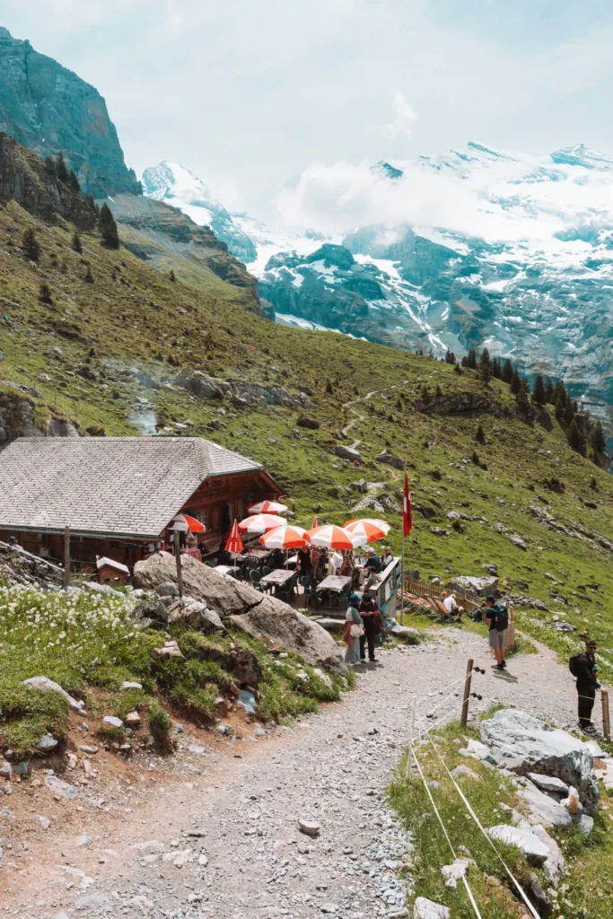 Hiking in Switzerland with views over mountains and alpine lakes