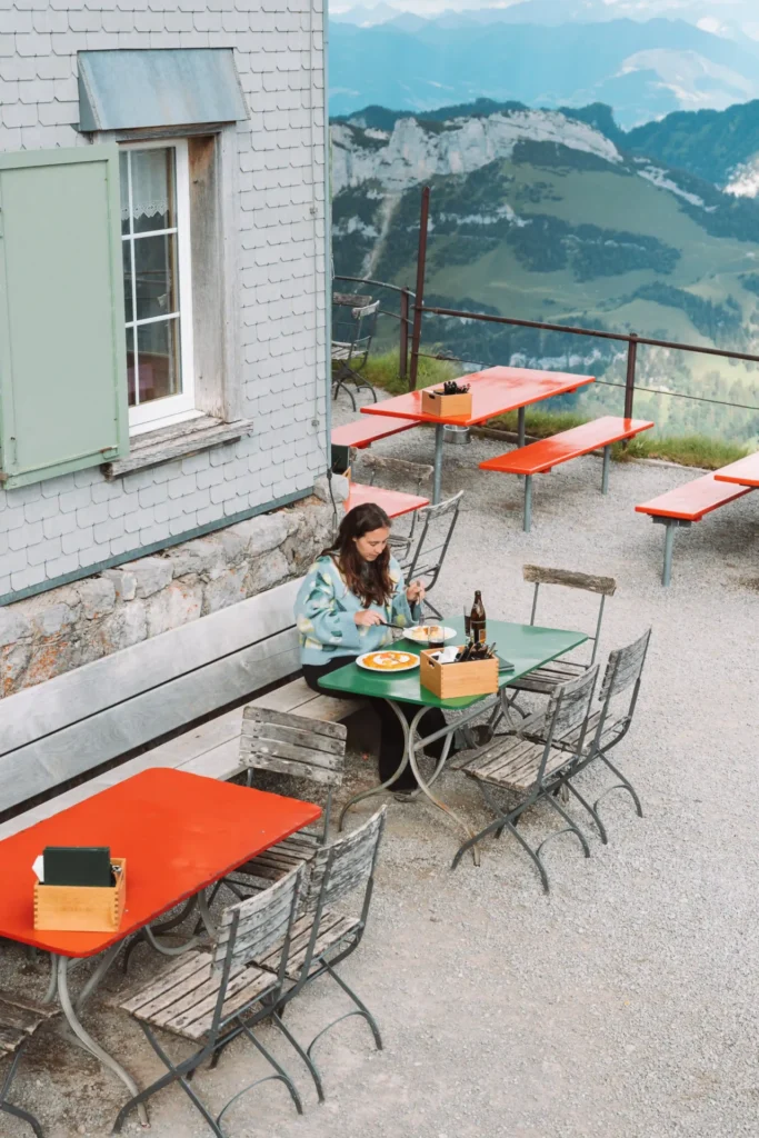Terrace of a Swiss Berggasthaus with panoramic mountain views