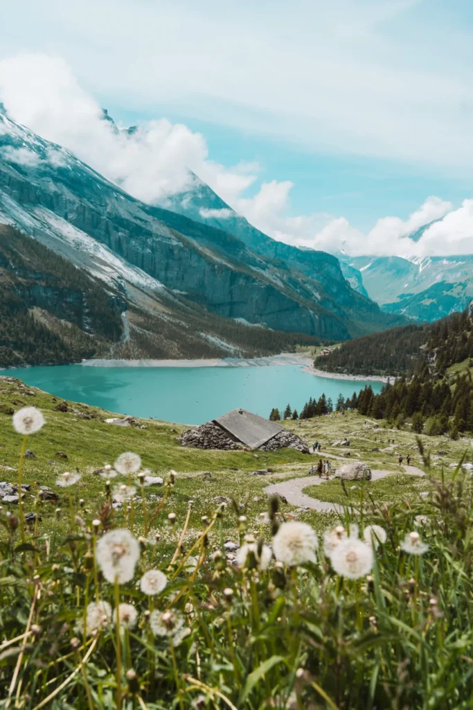 Hiking in Switzerland with views over mountains and alpine lakes