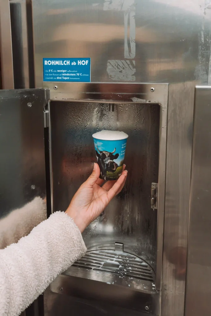 Fresh milk vending machine set up next to a farm in Switzerland